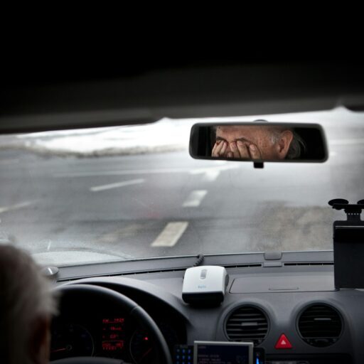 person driving car during daytime